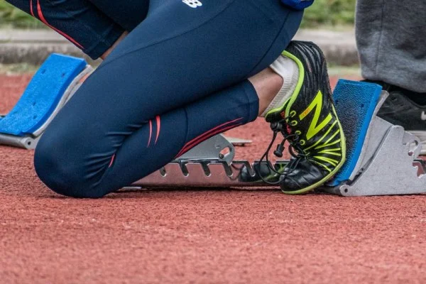 female sprinter starting blocks